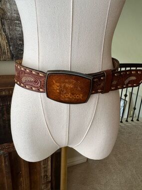 Vintage western hand tooled saddle leather belt with “Bobcat” buckle- size 38